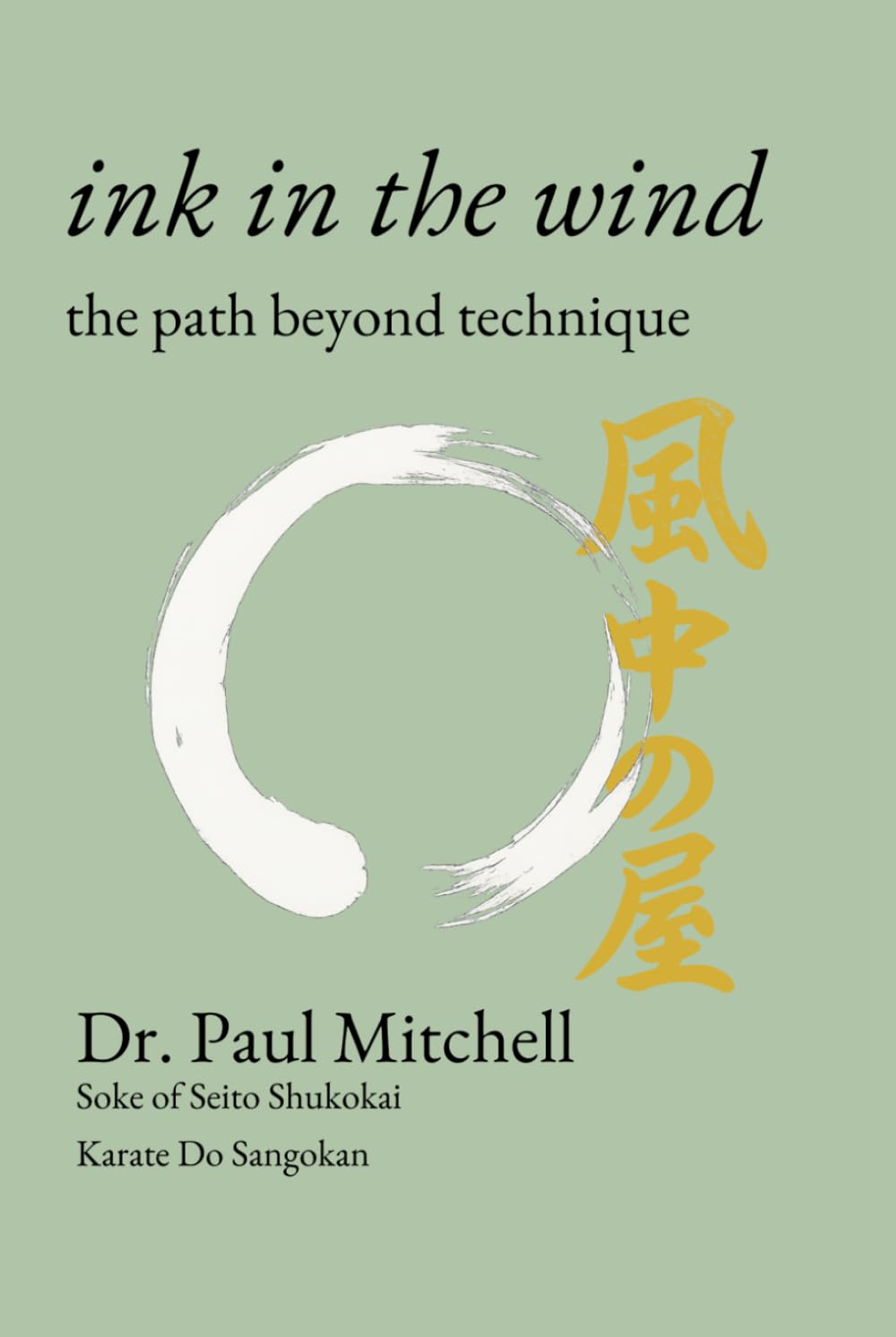 The cover of Ink in the Wind: a white ensō brush circle and gold calligraphy on sage green.